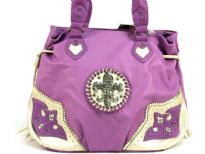 Fleur De Liz Licensed Handbag in Shining PVC. Bag has patchwork design in the corners in contrasting color. Double handle & hanging fringes on the sides of the bag. Top zipper closure. Fleur De Liz logo in center with rhinestones on it. 