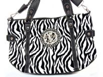 Animal Print Fleur De Liz Handbag with double shoulder handle as well as removable long shoulder strap. Top zipper closing.