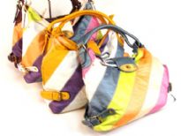 Designer Inspired Hobo Handbag has a single double strap, a twist lock closure and a metallic multi color stripes pattern. Made of faux leather.